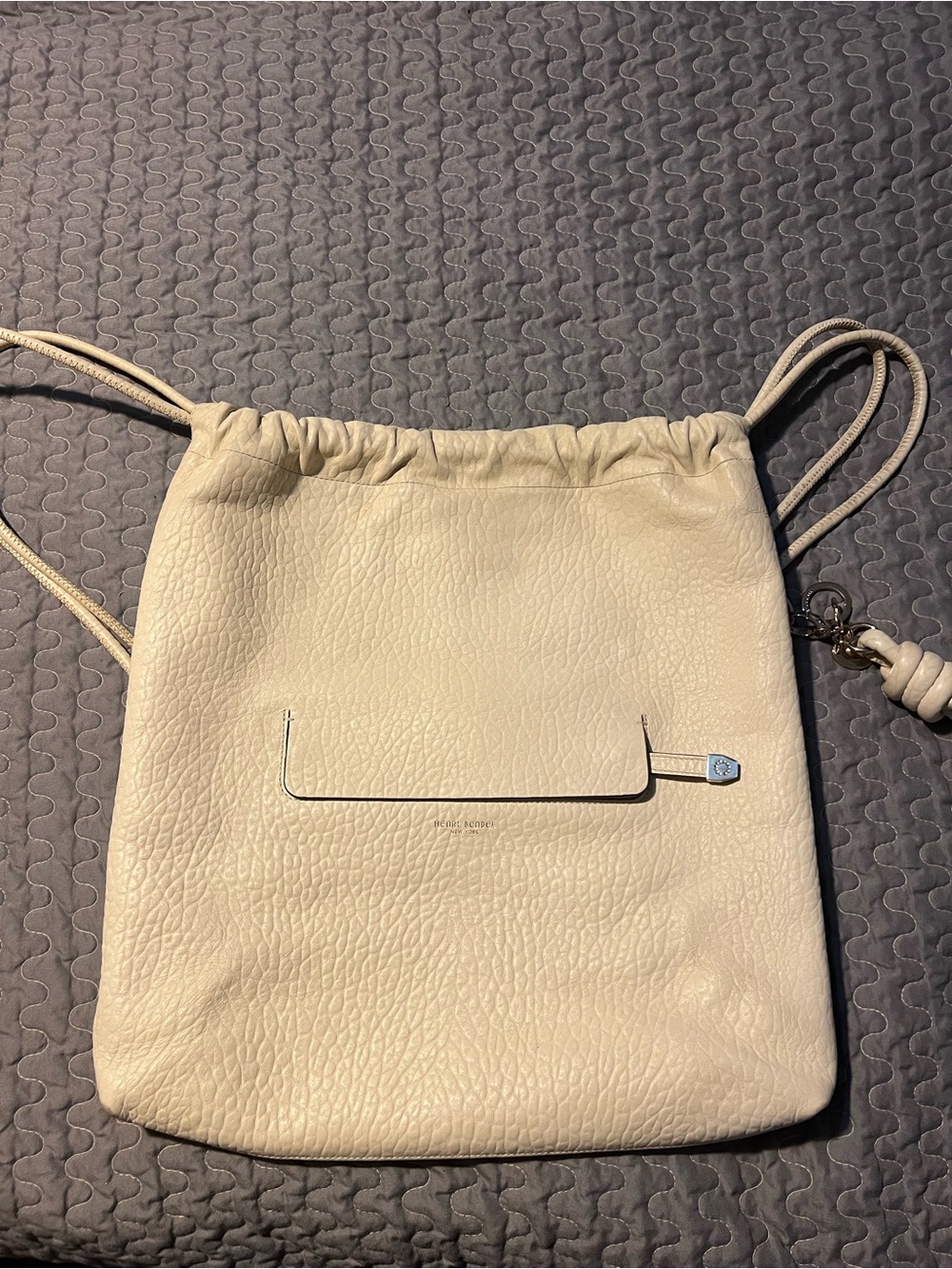 henri bendel Cream Pebbled Leather Drawstring Backpack